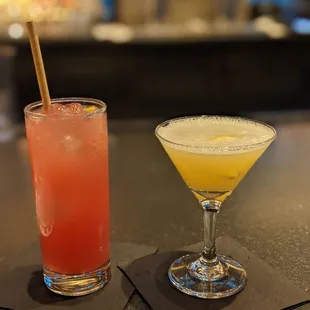 two cocktails on a bar