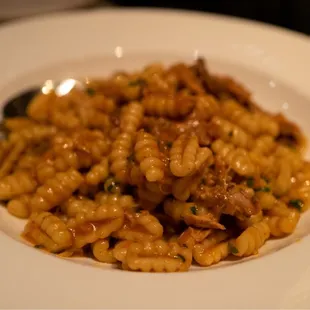 a plate of pasta with meat