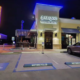 a car parked in front of a restaurant