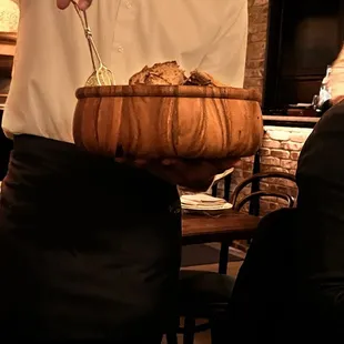 a man holding a bowl of food