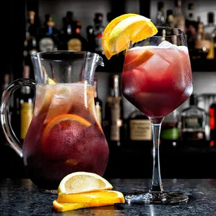 a pitcher of sangico and a glass of sangico