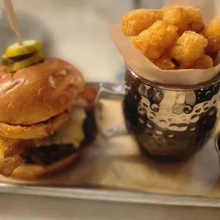 a burger and fries on a tray