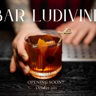 a person holding a drink