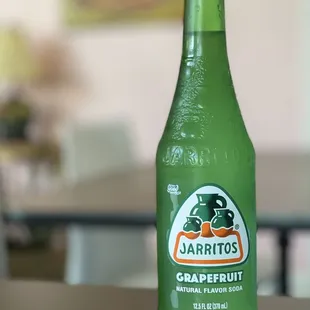 a bottle of grapefruit on a table