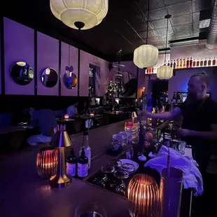 a man in a black shirt at a bar