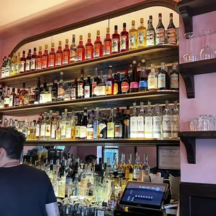 a man behind a bar counter