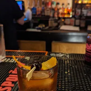 a drink in a glass on a bar table