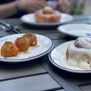 Arancini, cinnamon roll, and glazed donut