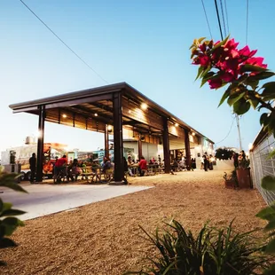 people sitting at tables outside