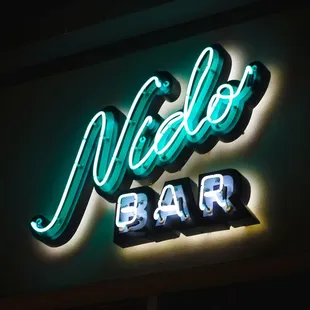 a neon sign for a bar