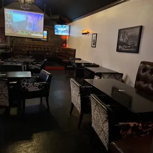 tables and chairs in a dimly lit room