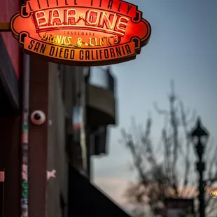 a neon sign on the side of a building