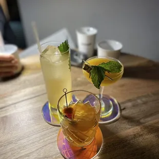 two cocktails on a wooden table