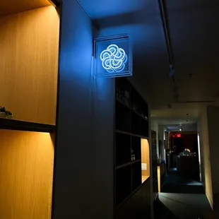a neon sign in a dimly lit room
