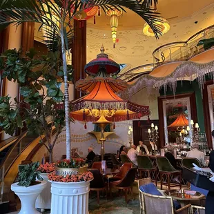 people sitting at tables in a restaurant