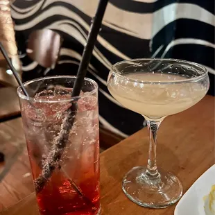 two cocktails on a wooden table