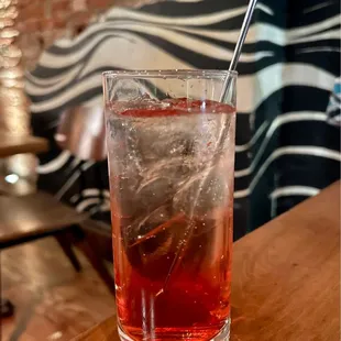 a drink with a straw in a tall glass