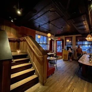 people sitting at tables in a restaurant