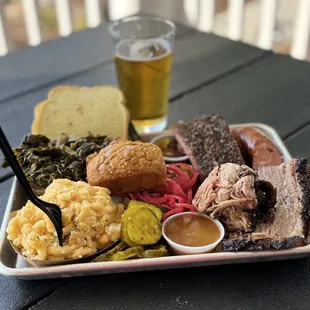 Platter w/ brisket, pulled pork, ribs &amp; sides of collards, macaroni &amp; cheese, bread. Bonus pumpkin loaf. Paired w/ a Octoberfest brew