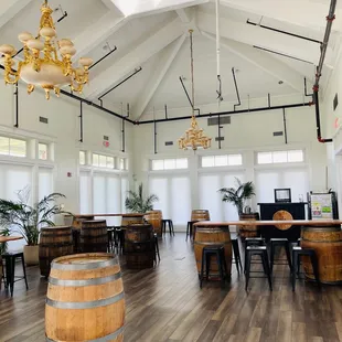 the interior of a restaurant with wooden barrels