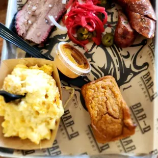 2 meat platter: brisket, sausage, Mac &amp; Cheese, sweet potato cornbread, house pickles