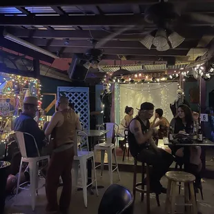 a group of people sitting at tables