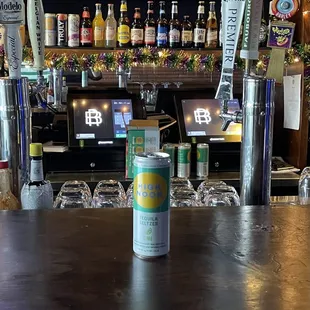a can of beer on a bar counter