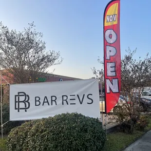 a sign in front of a building