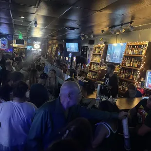 a large group of people at a bar