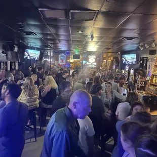a large group of people at a bar
