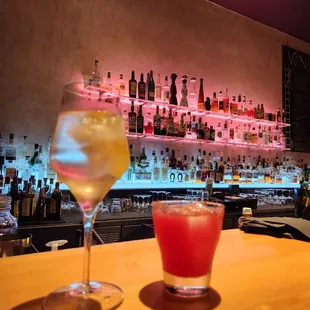 two cocktails on a bar counter