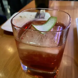 a drink in a glass with a lime slice