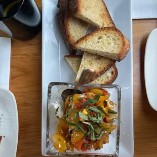 a plate of food with bread and vegetables