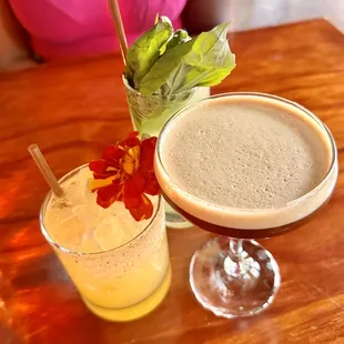 two cocktails on a wooden table