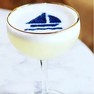 a cocktail with a sailboat motif