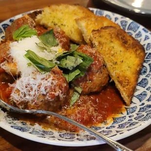 Roasted meatballs with ricotta, basil, polenta bread