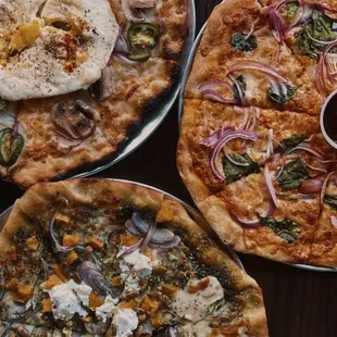 Breakfast pizza (top left), Basil Pesto (bottom left), Honey Badger (right)