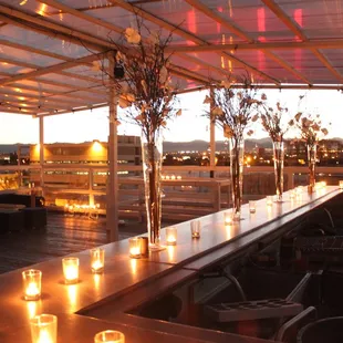 a long table with candles on it