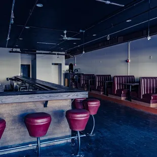 a row of red leather chairs