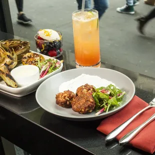 Lamb meatballs with cumin yogurt, whole grilled artichoke, fresh berries with Frangelico mascarpone, and Blood Orange Mule