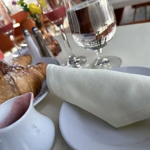 a plate of pastries and a glass of water