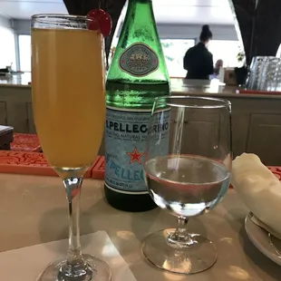 Peach mimosa and I was bougie and got the sparkling water