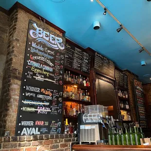 Bar with all the spirits and some cocktails on display