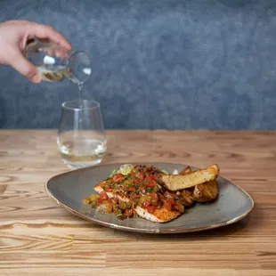 a plate of food and a glass of water