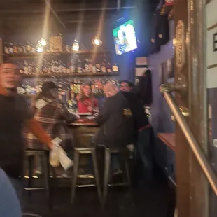 a group of people sitting at a bar