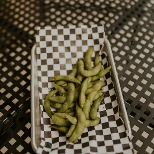 a tray of green beans on a table