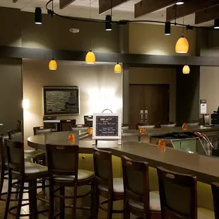 a view of a bar with stools