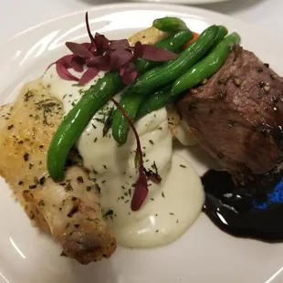 Petit Sirloin, balsamic reduction, herb roasted chicken, champagne cream, garlic mash, haricot verts
