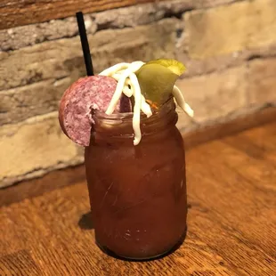 Blood Mary with local summer sausage, local cheese, pickle and olives.