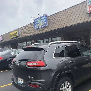 a jeep parked in front of a restaurant